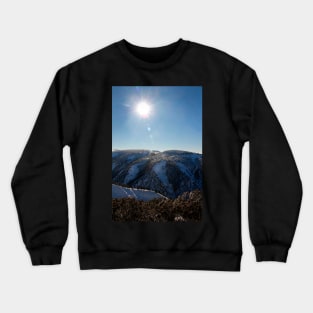 Sun on the mountainside in winter Crewneck Sweatshirt